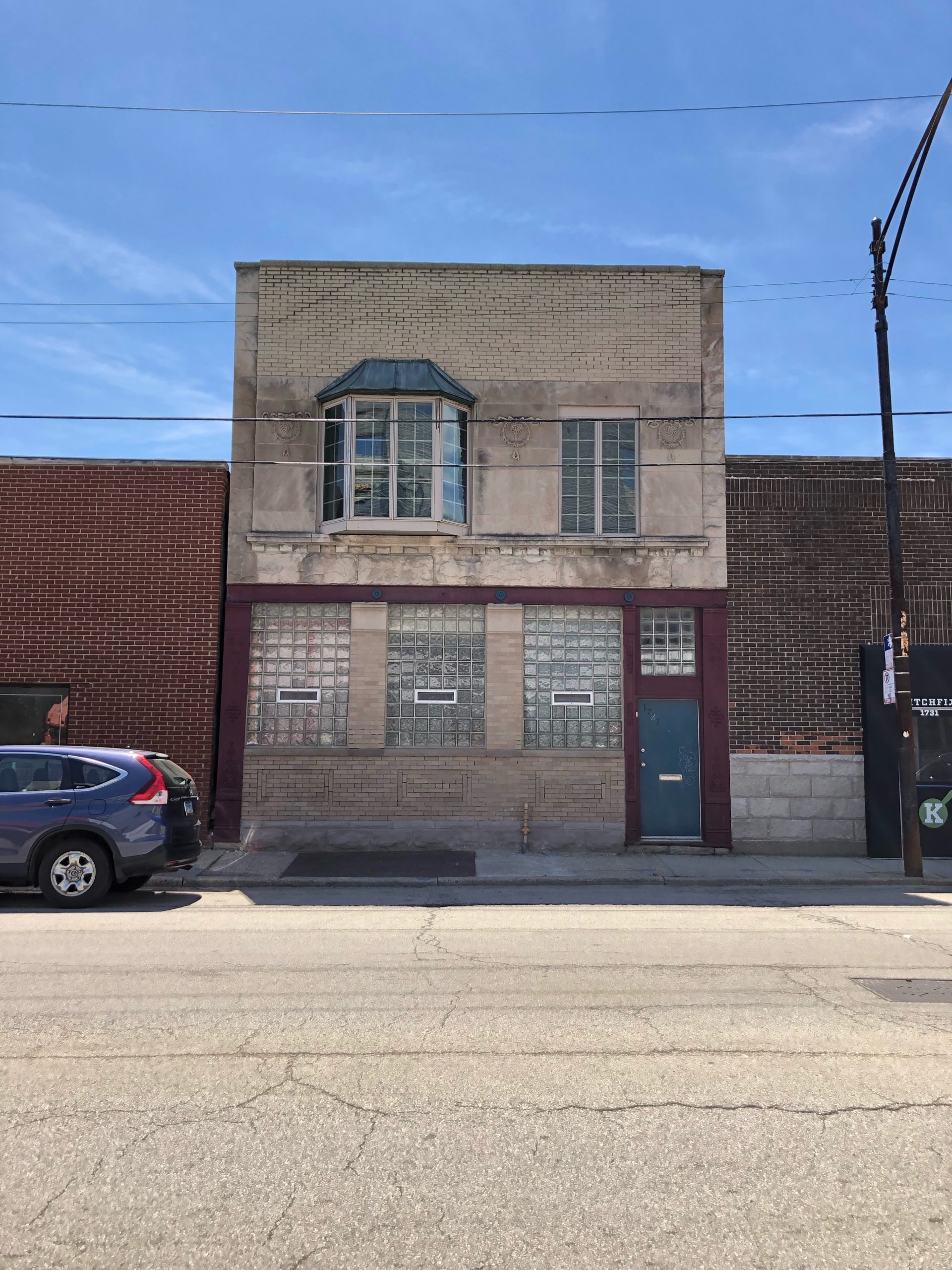 Two story stone and brick building - Cawley Commercial Real Estate