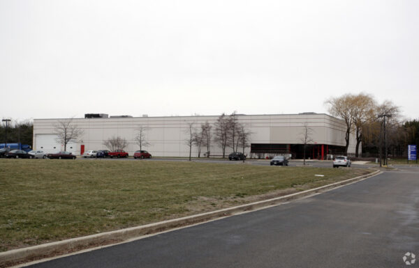 Street view of a corporate office space with a parking lot - Cawley Commercial Real Estate