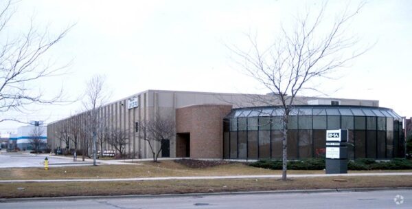 Street view of a corporate office space with a parking lot - Cawley Commercial Real Estate