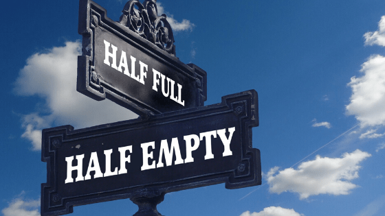 Crossing signs that say Half Full and Half Empty - Cawley Commercial Real Estate