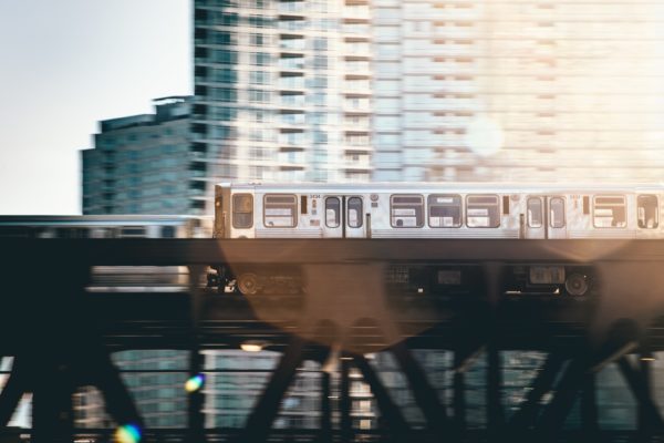 Side profile of The Chicago Brown Line on tracks - Cawley Commercial Real Estate